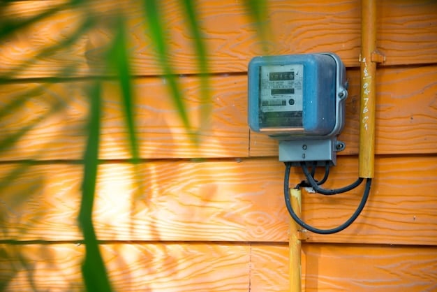 A close-up shot of a smart meter connected to a house, with solar panels visible on the roof in the background. The image symbolizes the integration of renewable energy into residential power systems and reflects how energy consumption and savings are measured and managed using modern technology.