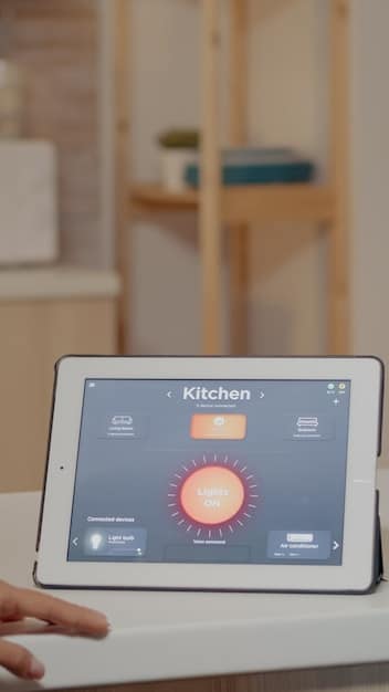 A close-up of a smart meter displaying different tariffs at different times of the day. The background is a modern kitchen.