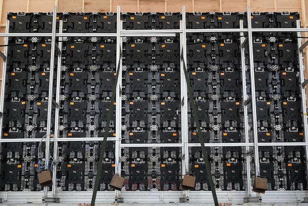 A grid-scale battery storage system, showcasing rows of battery modules in a controlled environment. The image highlights the importance of energy storage in supporting the integration of renewable energy sources.