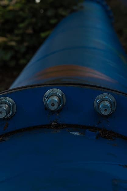 A close-up of sensors and underwater monitoring equipment installed near a hydroelectric dam. The equipment should be modern and high-tech, with cables and data transmission devices clearly visible.
