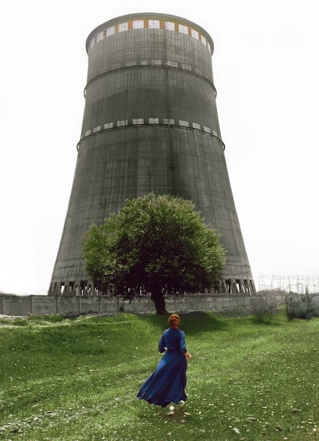 A split image showing a traditional coal power plant on one side and a modern wind turbine farm on the other, symbolizing the contrast between fossil fuels and renewable energy sources.