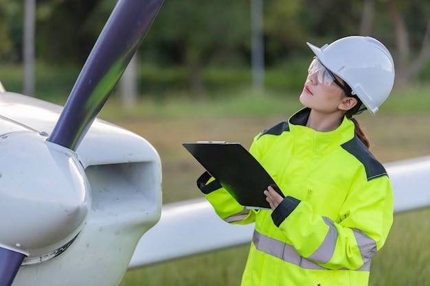 A close-up shot of a technician performing maintenance on a small wind turbine. The technician is wearing safety gear and using tools to inspect the blades. The background shows a rural landscape with other wind turbines in the distance.