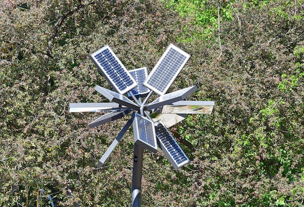 A close-up of various solar panel models, showcasing their different designs and technologies, set against a backdrop of a solar farm under a bright, sunny sky.