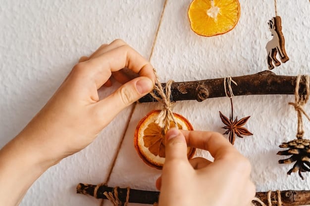 A close-up shot of hands crafting an ornament from dried orange slices, cinnamon sticks, and twine, highlighting the DIY aspect of sustainable holiday decorations. The background subtly shows more natural crafting materials like pinecones and dried flowers.