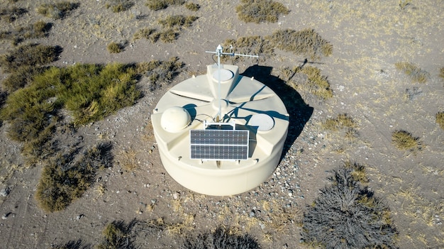 An aerial view of a carbon capture research facility, showcasing solar panels in its infrastructure to power the operation, illustrating commitment to renewable energy.
