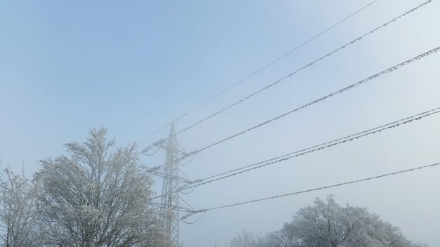 A damaged transmission tower with wires snapped and bent due to heavy ice accumulation, illustrating vulnerability of transmission lines to extreme weather conditions. The background shows a snowy landscape indicating the severity of the ice storm.