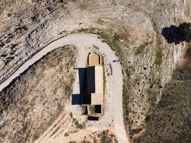 A drone shot of a large solar farm in the desert, illustrating the scale and potential of renewable energy infrastructure projects. The scene is bright and sunny, showcasing the technology's clean energy production.